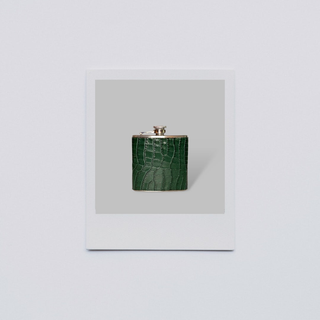 a 6 ounce flask covered in bottle green crocodile embossed leather